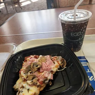 Pizza with ham and mushrooms. Diet Pepsi