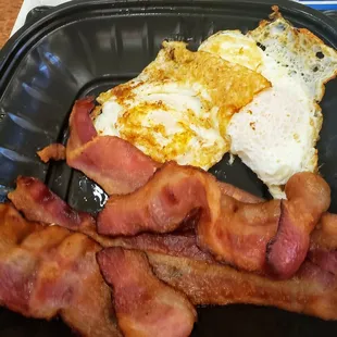 2  eggs, over easy and too greasy bacon