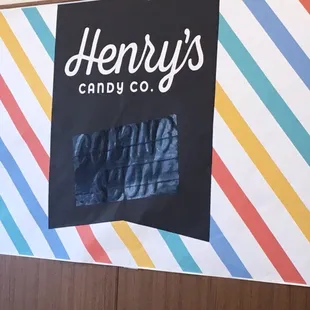 a sign for henry&apos;s candy company