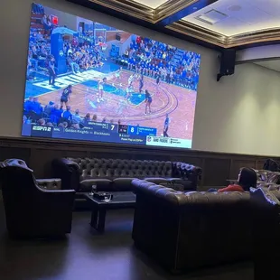 Large screen TV in Cigar Lounge