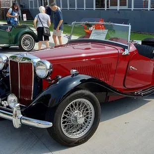 classic cars parked in a parking lot