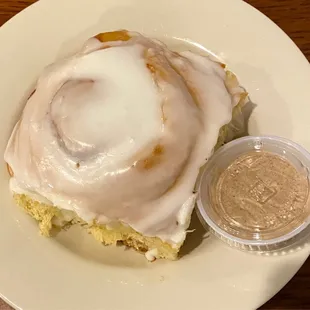 a cinnamon roll with icing