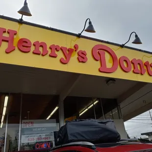 a car parked in front of a donut shop