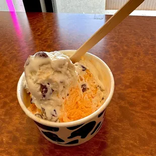 One scoop of Guava and one scoop of Vanilla Almond in a regular size cup