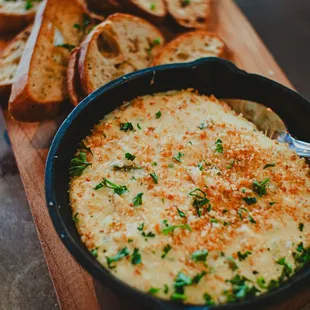 a skillet of cheese and bread