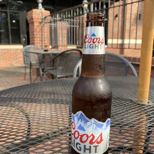 a cold beer on a table