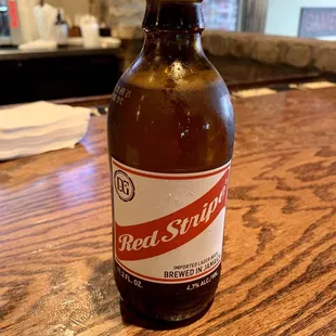 a bottle of red stripe beer