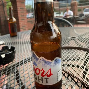 a bottle of beer on a table