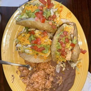 3 puffy taco plate with shredded chicken