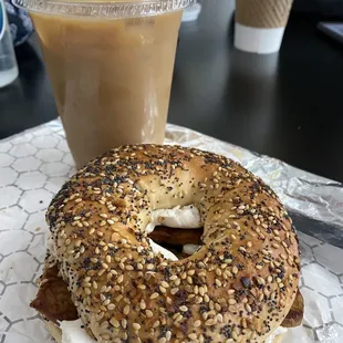 The real vegan - everything bagel with vegan cheese and tempeh bacon. Iced Oatmilk latte with caramel syrup
