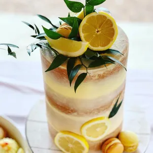a cake with lemons and macaroons