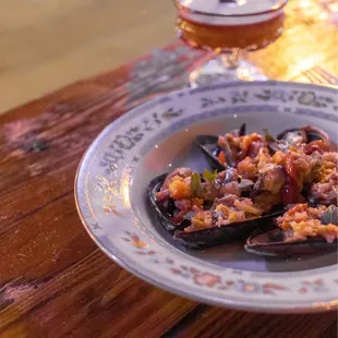 a plate of food and a glass of wine