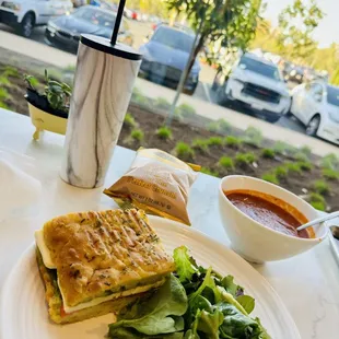 a plate of food and a cup of soup