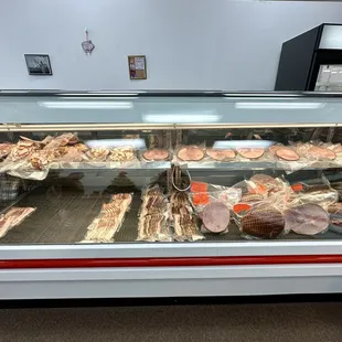Display case of bacon and ham