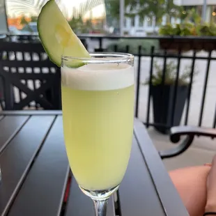 a glass of lemonade on a table