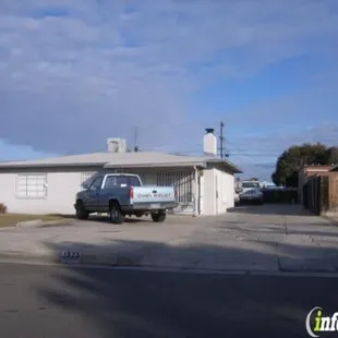 two cars parked in front of a house