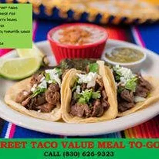 a plate of tacos and salsa