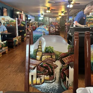 Beautiful carved tables and chairs. Such colorful and fun decor