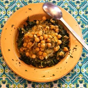 Chickpea picatta on mashed potatoes and greens.