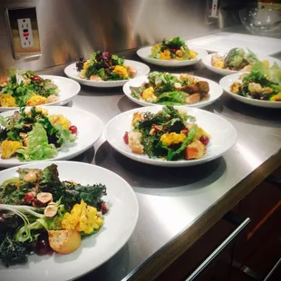 Beautiful salads of winter greens, roasted orange cauliflower, red grapes, toasted hazelnuts and a mustard seed vinaigrette