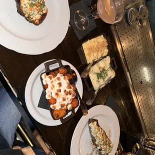 Filet , rib eye , blue cheese crust, sweet potato tots with marshmallow, potatoe puree, army and navy drink, Truffle Mac and Cheese