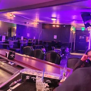 a woman sitting at a bar