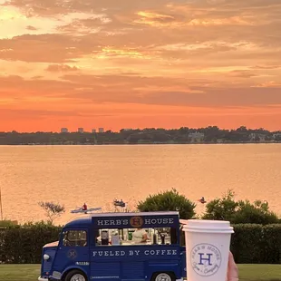a person holding a cup of coffee