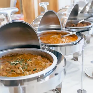 a variety of dishes on a buffet table