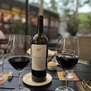 a bottle of wine and two glasses of wine