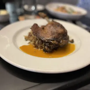 Muscovy Duck Leg Confit with Dirty Rice and Citrus Gastrique