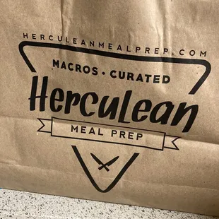 a brown paper bag with a logo on it