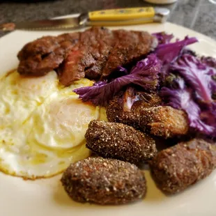 Steak and eggs with blue corn dusted tots.