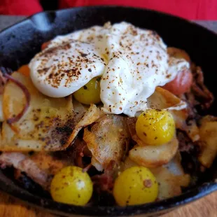 Burnt end hash skillet with organic eggs and blistered tomato salsa.