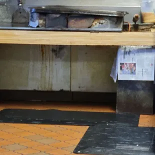 That is where the magic happens held together with bailing wire probably original cook top with original grease... yummo!!