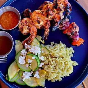 Beautifully cooked beef and shrimp with just right veggie rice and bright tasy squash with feta.