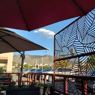 A great view of the mountains from the patio well covered with large umbrellas.