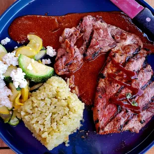 Beef cooked beautifully. Just right veggie rice. Bright fresh squash with feta.