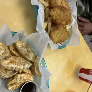 Gyoza and chicken nuggets and fries