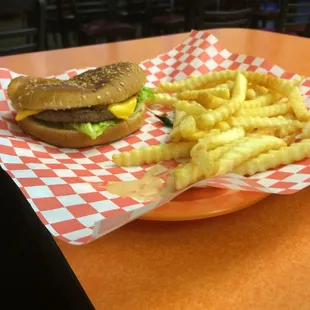 Half eaten because I couldn&apos;t wait. Filling burger (usually with more condiments but I like it plain) and yummy fries and fry sauce.