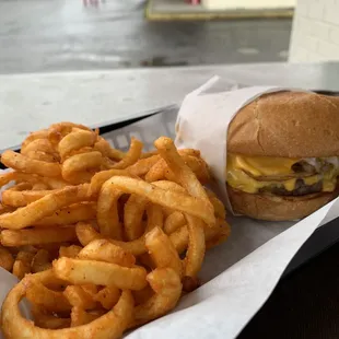 Curly fries and onion burger.