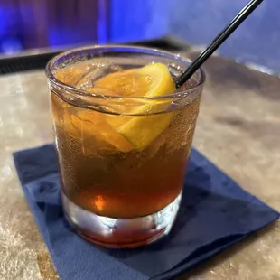 a drink in a glass on a napkin