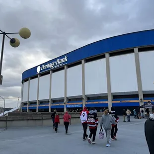 a group of people walking in front of it
