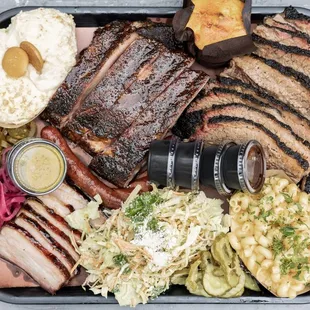 This is what 2 lbs of brisket, 1.5 lbs spareribs, half lb char siu pork belly, and small mac, slaw, banana bread pudding look like