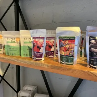 a variety of coffees on a shelf