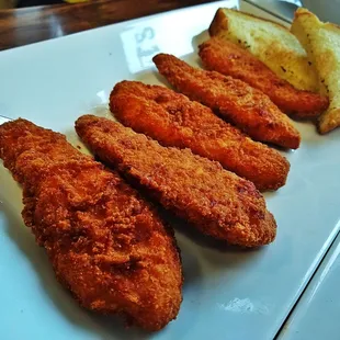 a plate of fried fish and bread