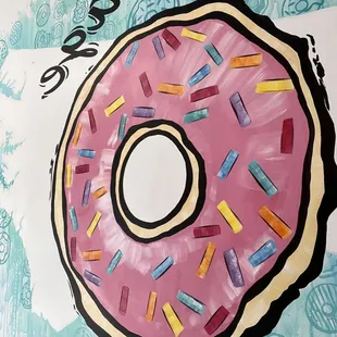 a pink donut with sprinkles