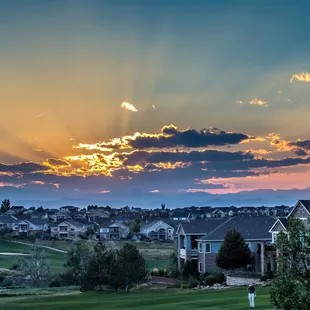 Heritage Eagle Bend Golf Club looking out from the patio during sunset at the Rocky Mountains.