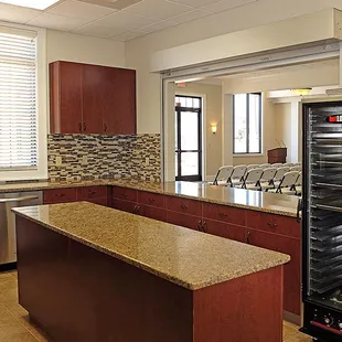 A convenient serving window in the kitchen is helpful for certain events.