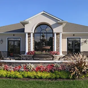 The flowers around the fountain and patio change with the season.