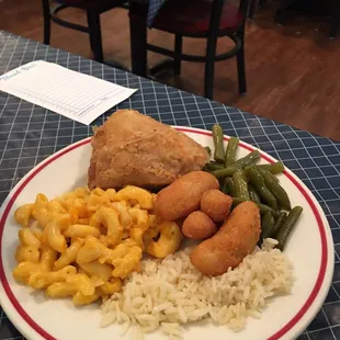 Rice, hush puppies, green beans, mac n cheese, fried chicken